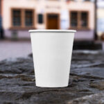 Facing View of Open Paper Cup Mockup on Wall