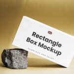 Facing View of Paper Box Mockup on Rock