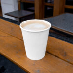 Facing View of Paper Cup Mockup with Coffee