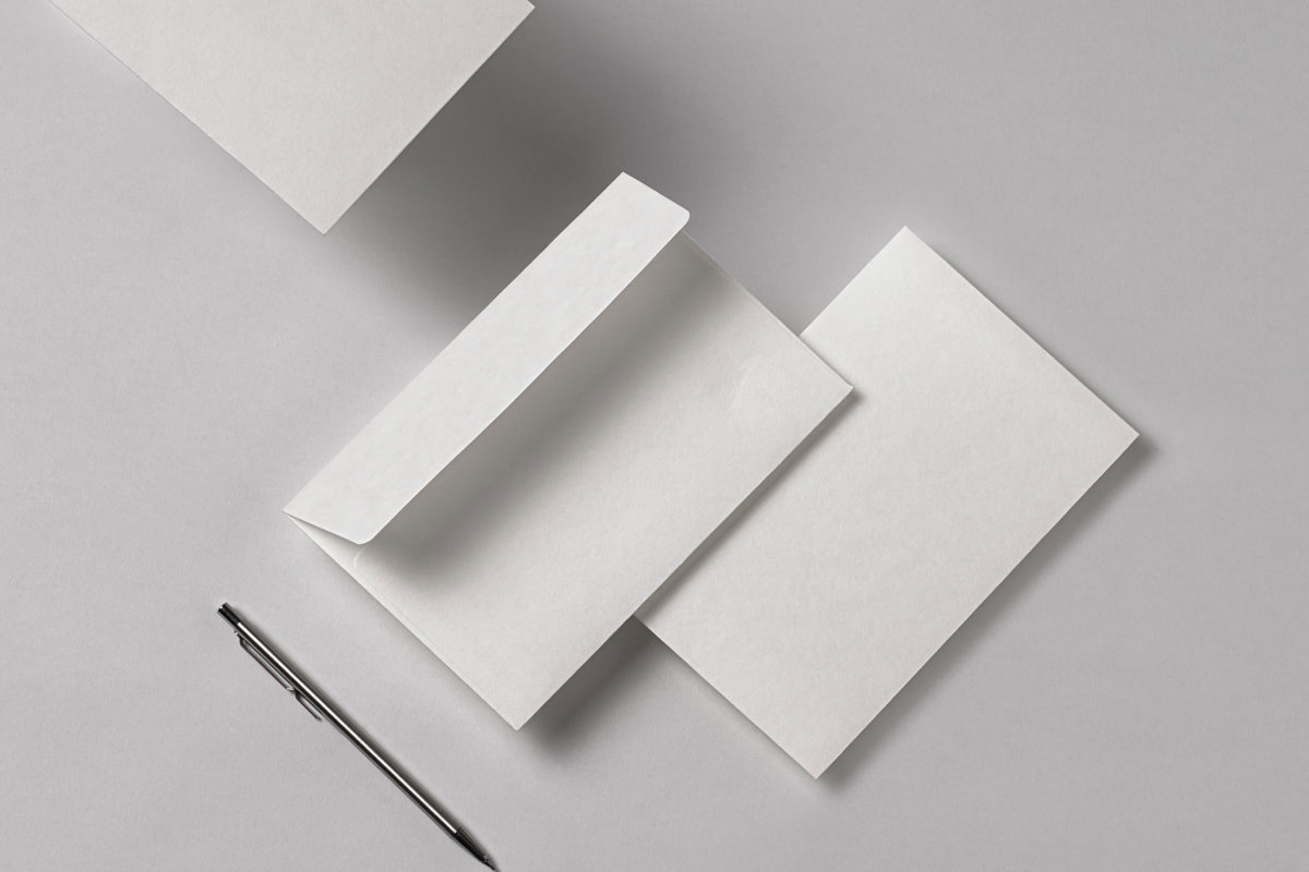 Free Facing View of Stationery Mockup with Envelope PSD Template
