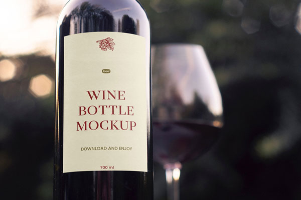 Facing View of Wine Bottle Mockup with Glass