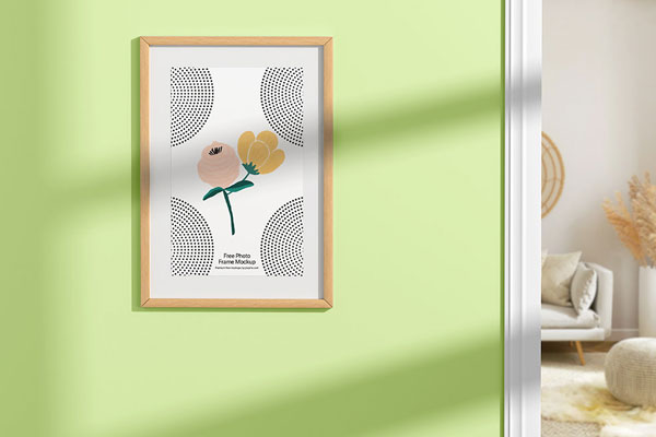 Facing View of Wooden Photo Frame Mockup on Wall