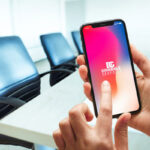 Female Hands Using iPhone X in Conference Room Mockup