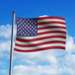 Flag Flapping in the Wind in Blue Sky Mockup