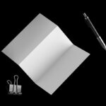Floating A4 Trifold Brochure Mockup Featuring Binding Clip and a Pen