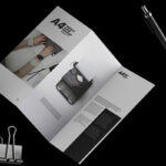Floating A4 Trifold Brochure Mockup Featuring Binding Clip and a Pen