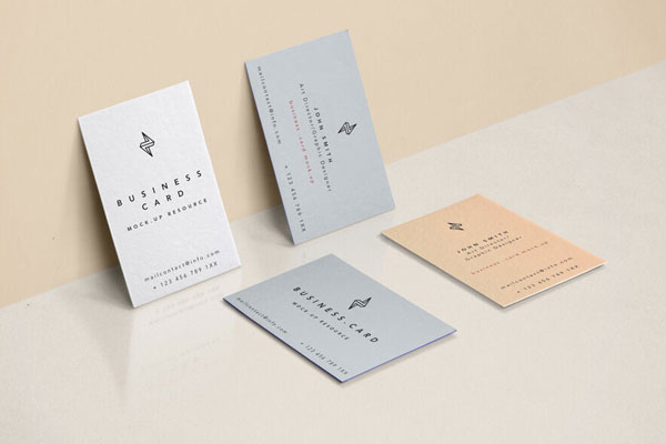 Four Business Cards Against Wall and Fitted on Floor Mockup