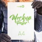 Four Mockups Featuring Girl Holding Poster in Snowy Background