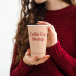 Front Shot of Coffee Cup Mockup in Women Hands