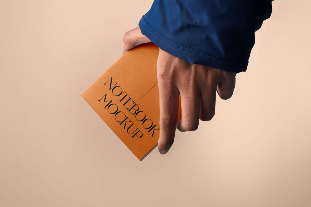 Front Sight of A5 Notebook Mockup in Hand