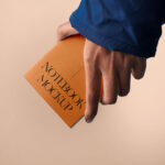 Front Sight of A5 Notebook Mockup in Hand