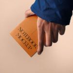 Front Sight of A5 Notebook Mockup in Hand