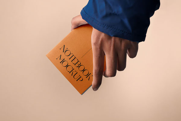 Front Sight of A5 Notebook Mockup in Hand