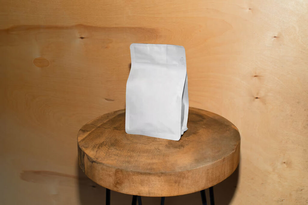 Front Sight of Paper Coffee Bag Mockup on Wooden Stool