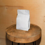 Front Sight of Paper Coffee Bag Mockup on Wooden Stool