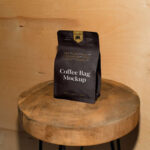 Front Sight of Paper Coffee Bag Mockup on Wooden Stool