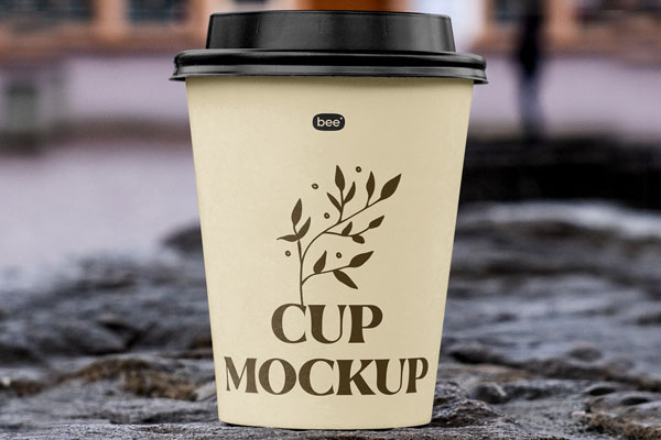 Front Sight of Paper Cup Mockup on Stone Wall