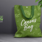 Front View Canvas Bag Leaning Against Wall Mockup with Leaves