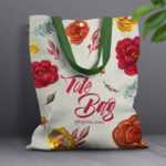 Front View Canvas Bag Leaning Against Wall Mockup with Leaves