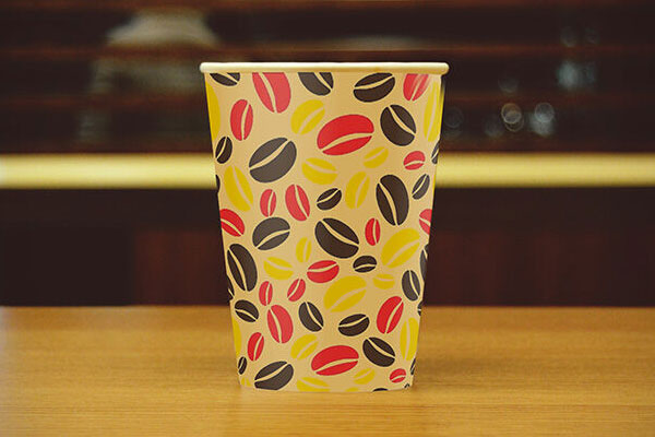 Front View Coffee Cup on Café Table Mockup