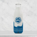 Front View Glass Milk Bottle Standing on Table Mockup
