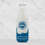 Front View Glass Milk Bottle Standing on Table Mockup