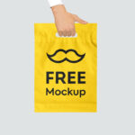 Front View Hand Holding Plastic Shopping Bag Mockup