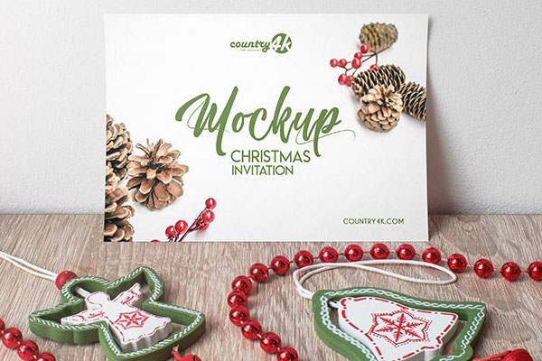 Front-View, Horizontal Invitation\ Greeting Card Mockup Featuring Christmas Tree Tassel Ornaments
