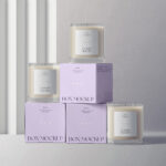 Front View Mockup of 3 Candle Glass Jars and Their Boxes