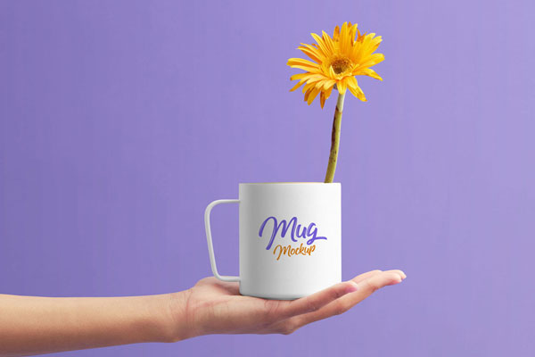 Front-View Mockup of a Mug in the Palm of a Hand