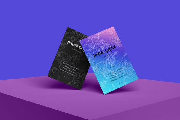 Front-View Mockup of Two Business Cards Standing at an Angle