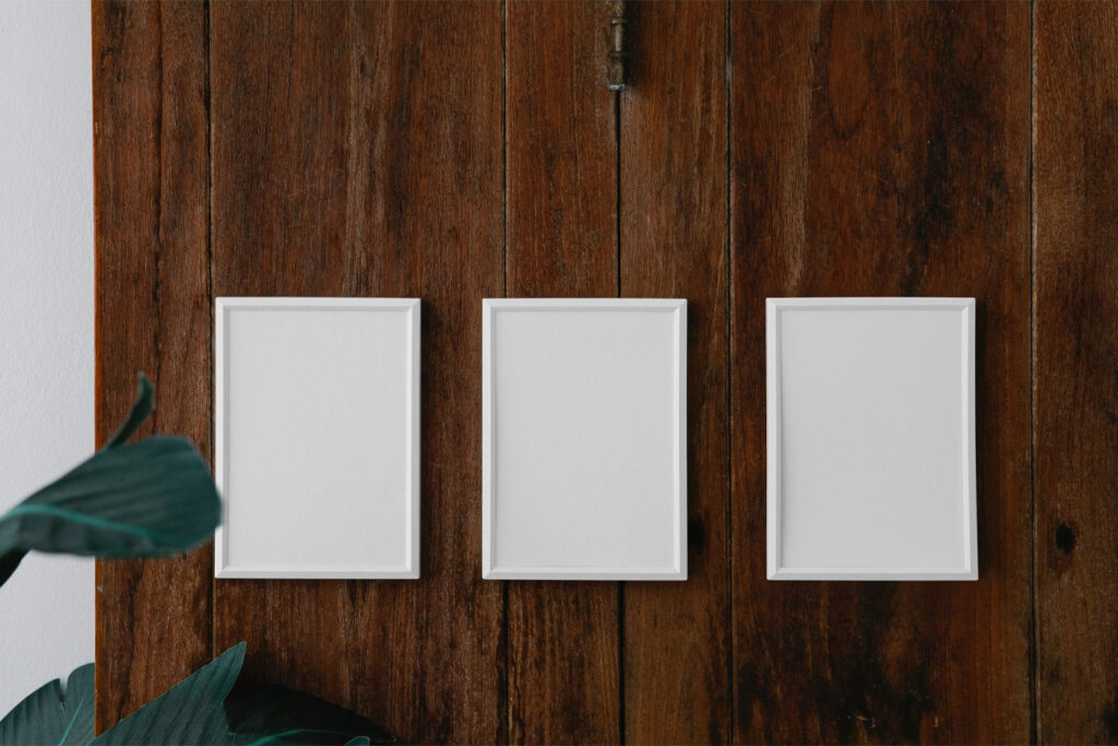 Front View of 3 Minimal Posters Mockup on Wood Wall