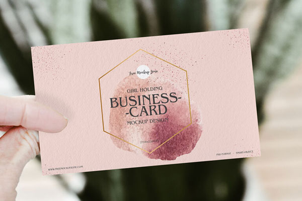 Front View of a Business Card Held Up by a Hand Mockup