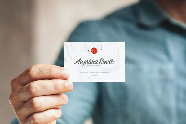 Front View of a Business Card in a Man’s Hand Mockup