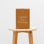 Front View of a Cardboard Box Mockup on a Wooden Chair
