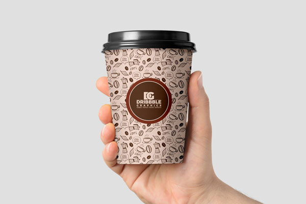 Front View of a Coffee Cup in Man’s Hand Mockup