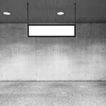 Front View of a Concrete Wall Mockup and a Hanging Sign Mockup