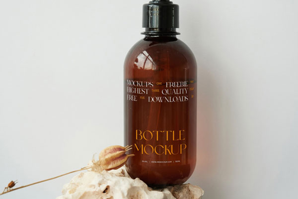 Front View of a Cosmetic Bottle Mockup on a Stone