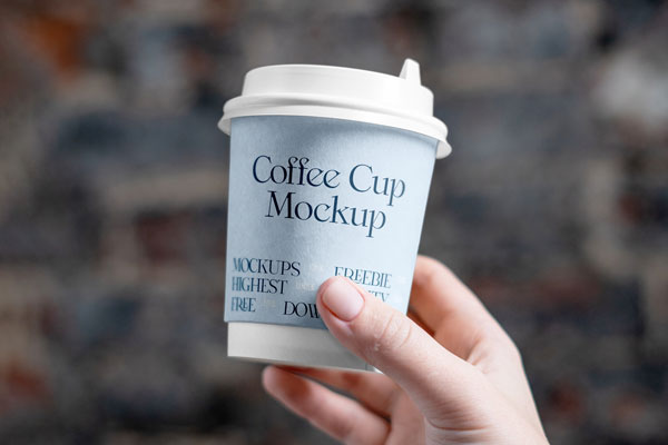 Front View of a Hand Holding a Coffee Cup Mockup