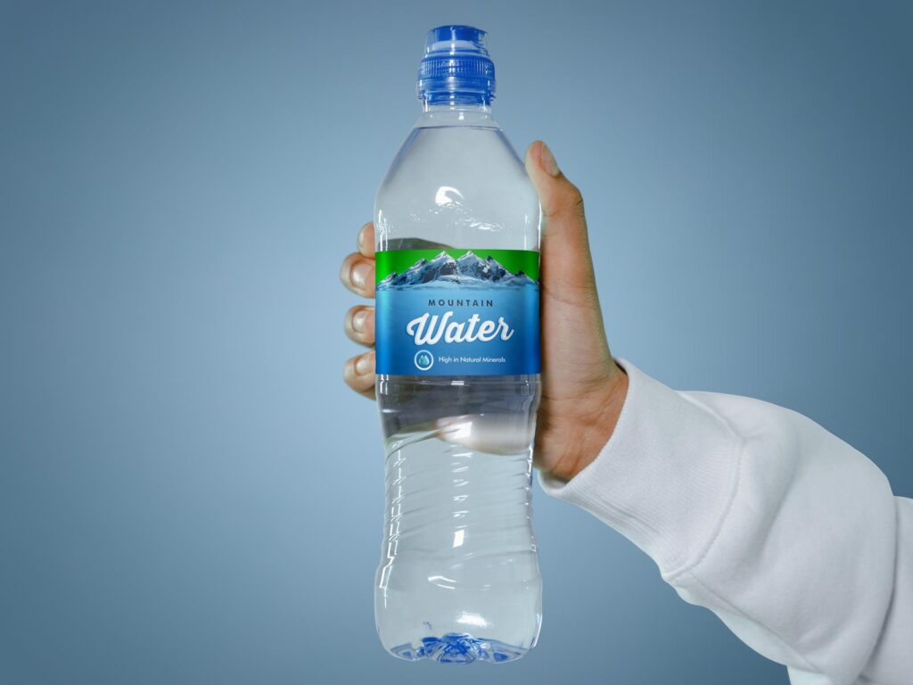 Front View of a Hand Holding a Water Bottle Mockup