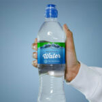 Front View of a Hand Holding a Water Bottle Mockup