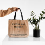 Front View of a Hand Holding Canvas Bag Mockup