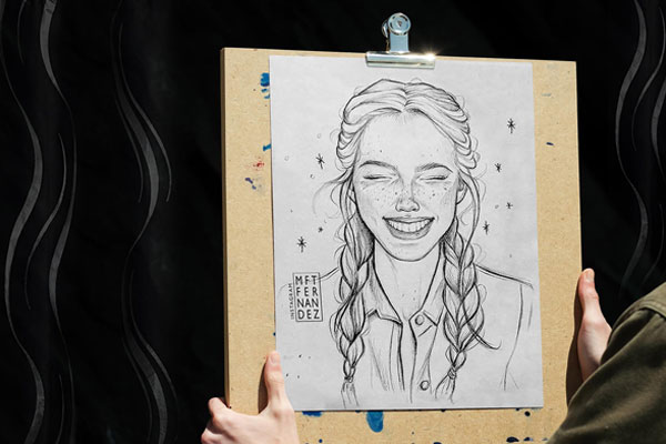 Front View of a Hand Holding Drawing Board Artwork Showcase Mockup