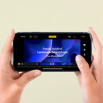 Front View of a Hand-Holding Landscape Smartphone Screen Mockup