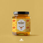 Front View of a Hexagonal Honey Jar Mockup with a Lid