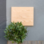Front View of a Wooden Shop Sign on Wall Mockup