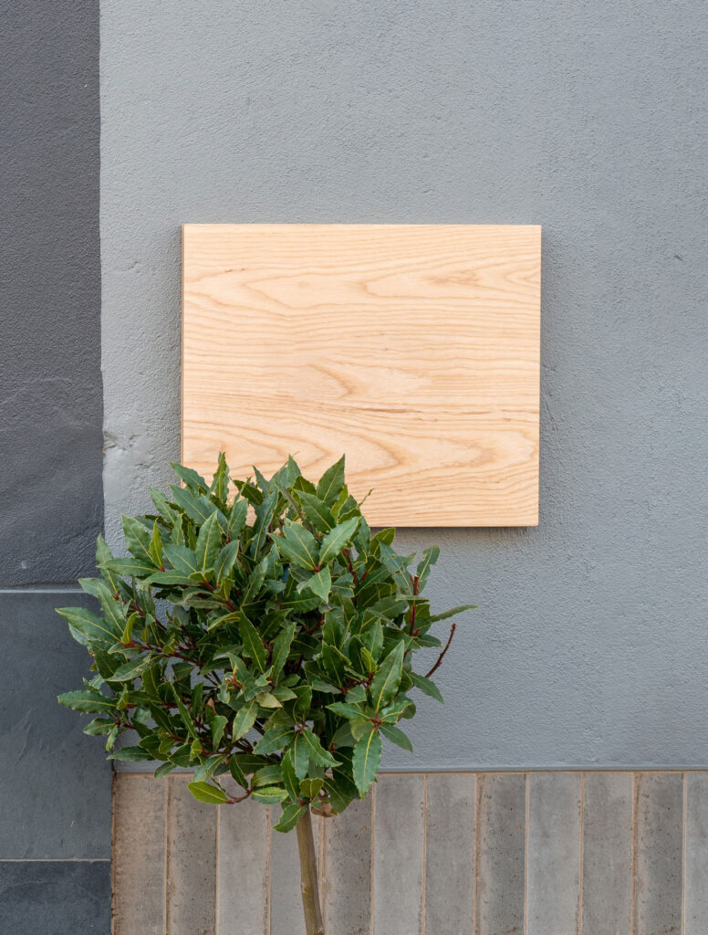 Front View of a Wooden Shop Sign on Wall Mockup