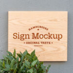 Front View of a Wooden Shop Sign on Wall Mockup