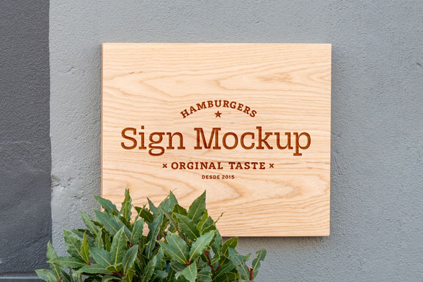 Front View of a Wooden Shop Sign on Wall Mockup