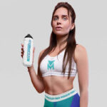 Front View of Athletic Woman Wearing Sportswear with a Bottle Mockup